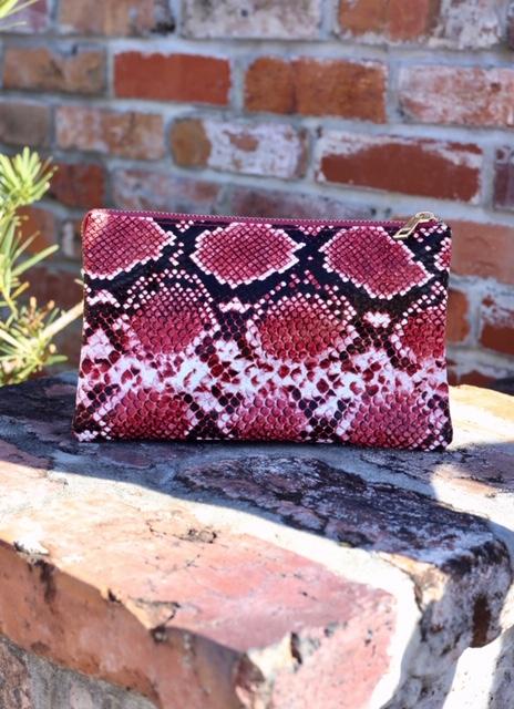 Pink snake print online clutch bag